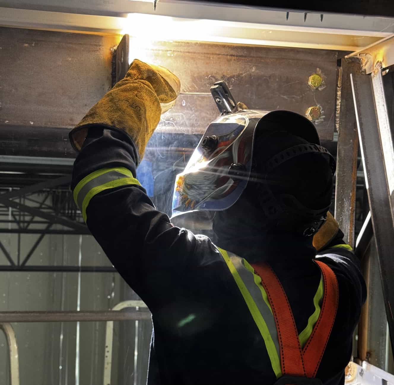 Overhead welding on structural steel at a Tampa Bay job site