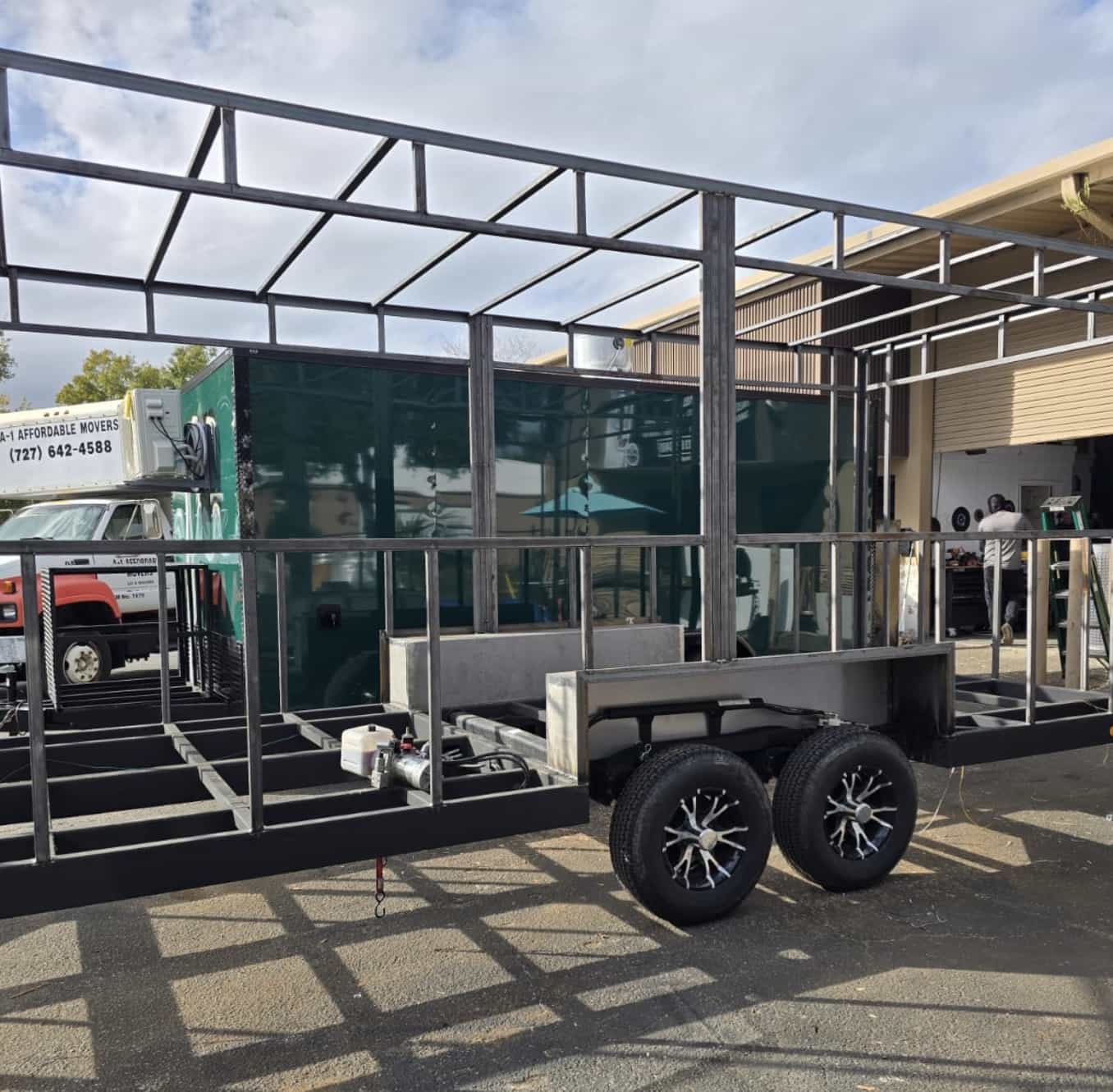 Custom steel canopy frame fabricated and fitted onto a tandem-axle trailer. — Tampa Bay, FL